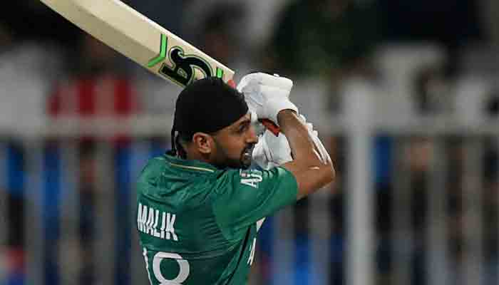 Pakistans Shoaib Malik plays a shot during the ICC Mens Twenty20 World Cup cricket match between Pakistan and Scotland at the Sharjah Cricket Stadium in Sharjah on November 7, 2021. -AFP