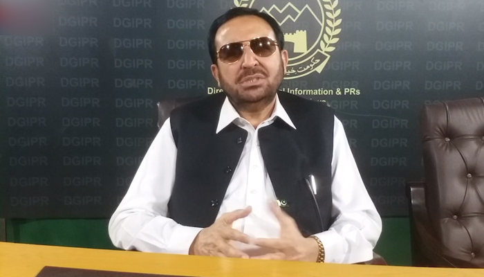 KP Transport Minister Shah Muhammad Khan addressing a press conference. — File