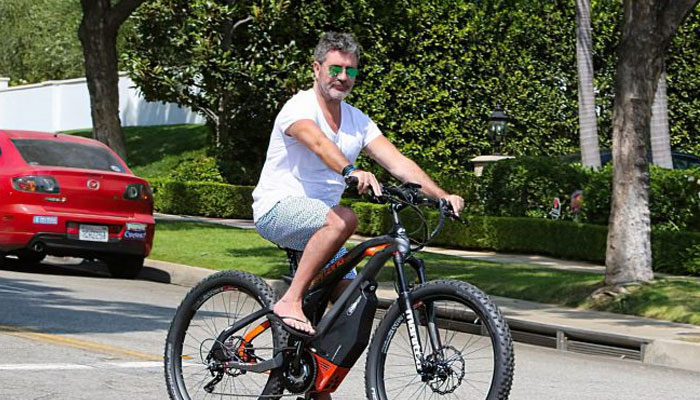 Simon Cowell breaks arm, lucky to be alive after bike crash