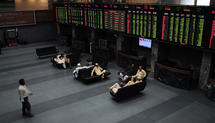 Investors can seen sitting in the main hall of the Pakistan Stock Exchange. — AFP/File