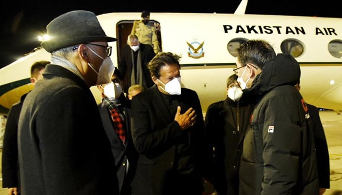 Prime Minister Imran Khan gestures after arriving in Beijing for his four-day visit, on February 3, 2022. — Radio Pakistan