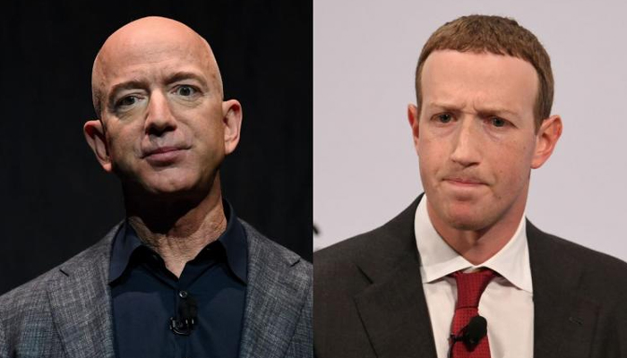 Jeff Bezos (left) and Mark Zuckerberg. — Reuters/File