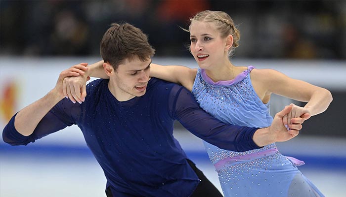 Nolan Seegert (left), seen performing with Minerva Fabienne Hase, was confirmed as the first positive COVID-19 case among the German team on Wednesday. — AFP/File