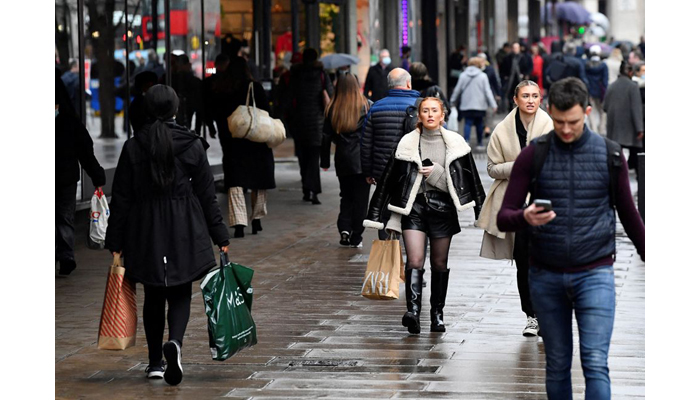 Shoppers walk on Oxford Street, as rules on wearing face coverings in some settings in England are relaxed, amid the spread of the coronavirus disease (COVID-19) pandemic, in London, Britain on January 27, 2022. — Reuters/File