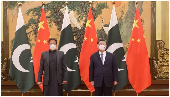 Prime Minister Imran Khan (L) meets Chinese President Xi Jinping (R) at the Great Hall of People in Beijing — PM Office