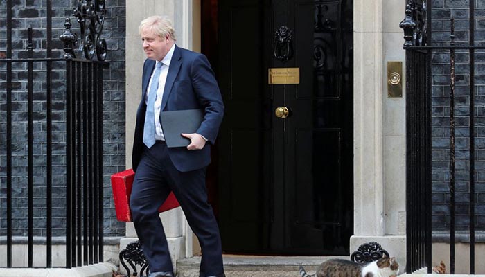 British Prime Minister Boris Johnson walks outside 10 Downing Street in London, Britain, January 31, 2022. REUTERS/FILE