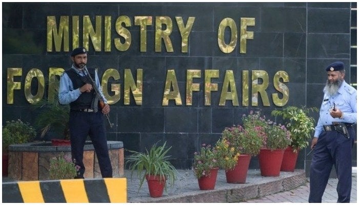 Two guards stand outside of the Ministry of Foreign Affairs office in Islamabad, Pakistan. — AFP