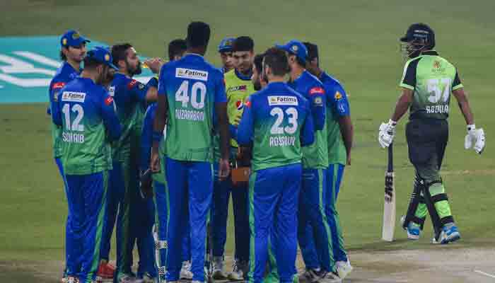 Multan Slutans´ players celebrate after the dismissal of Lahore Qalandars´ Abdullah Shafique (R) during the Pakistan Super League (PSL) Twenty20 cricket match between Multan Sultans and Lahore Qalandars at the Gaddafi Cricket Stadium in Lahore on February 11, 2022. -AFP