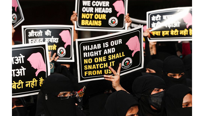 Women hold placards during a protest, organised by Hum Bhartiya, against the recent hijab ban in few colleges of Karnataka state, on the outskirts of Mumbai, India on February 11, 2022. &mdash; Reuters/File