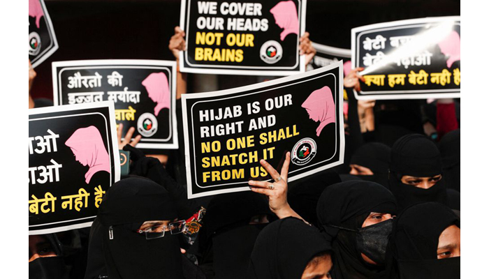 Women hold placards during a protest, organised by Hum Bhartiya, against the recent hijab ban in few colleges of Karnataka state, on the outskirts of Mumbai, India on February 11, 2022. — Reuters/File