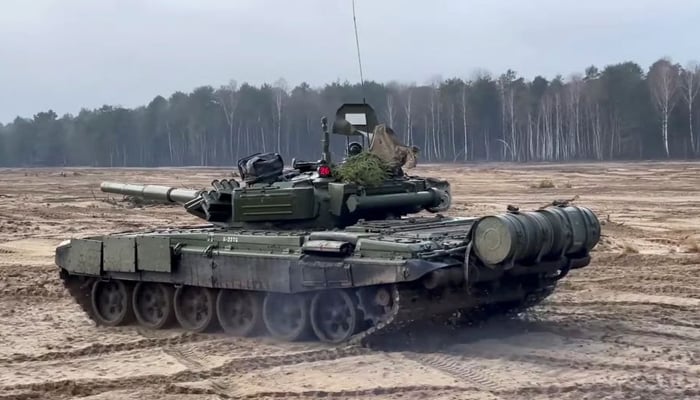 A tank drives during the Union Courage 2022 joint military exercise of the armed forces of Russia and Belarus, at the Brestsky training ground in Brest Region, Belarus, in this still image taken from video released February 11, 2022. — Reuters