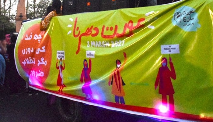 A banner calling for implementation of coronavirus SOPs at Aurat March 2021. Photo: Geo.tv/ file