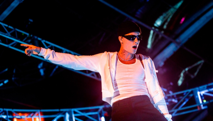 Police on Sunday looked for a gunman who fired shots outside a party that followed a Justin Bieber concert