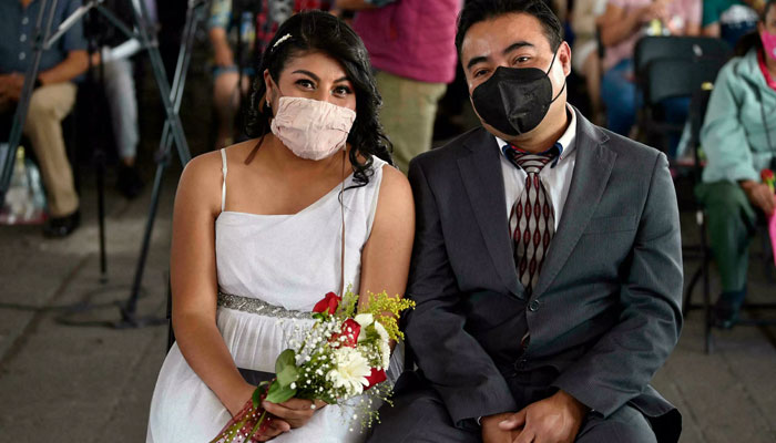 What the mass wedding lacks in intimacy it makes up for with perks such as free marriage certificates. AFP