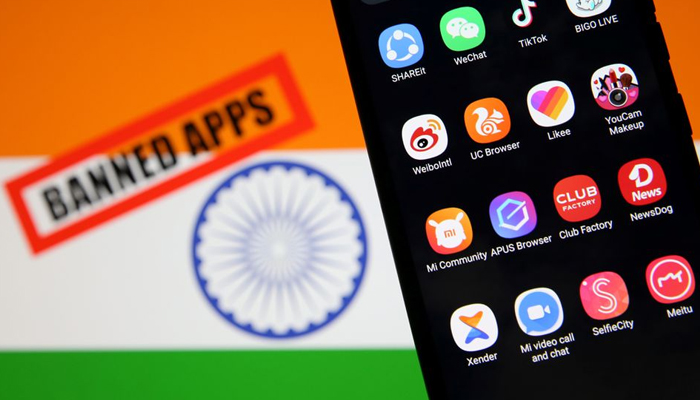 Smartphone with Chinese applications is seen in front of a displayed Indian flag and a Banned app sign in this illustration picture taken July 2, 2020. — Reuters