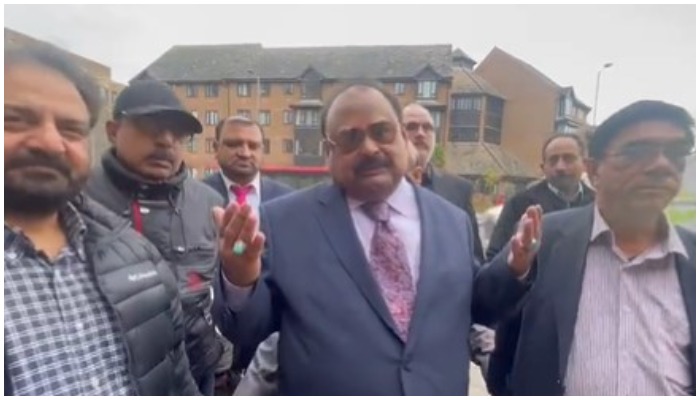 MQM supremo Altaf Hussain celebrates with his colleagues outside the court in London on February 15, 2022. — Murtaza Ali Shah