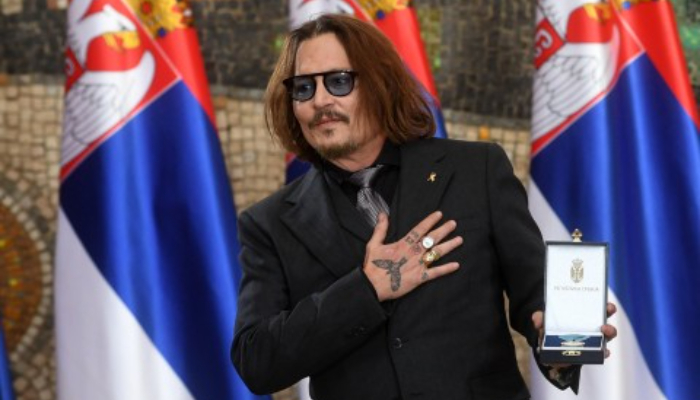 Johnny Depp said he’s on the verge of a new life as he received a Gold Medal of Merit from the Serbian president