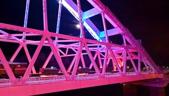 A view shows a freight train transporting Russian military vehicles, which leave the Crimean peninsula towards the Russian mainland along a railway bridge across the Kerch Strait, in this still image taken from video released February 16, 2022. — Reuters