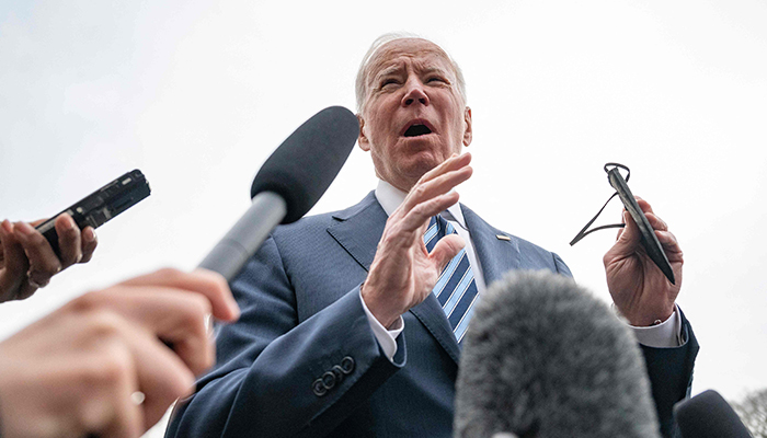 US President Joe Biden speaks with journalists prior to departing the White House in Washington, DC, on February 17, 2022. — AFP