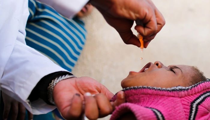 A boy receives polio vaccination drops during a house-to-house vaccination campaign in Sanaa, Yemen February 20, 2017. — Reuters