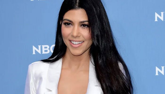 Kourtney Kardashian gets her fiancé Travis Barkers initials crafted