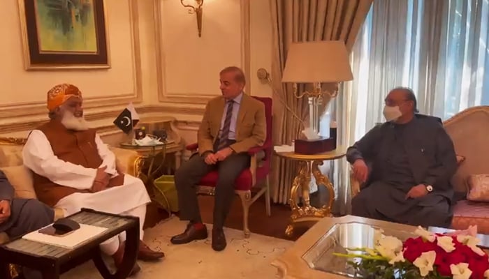 Pakistan Democratic Movement (PDM) chief Maulana Fazlur Rehman (left), Leader of the Opposition in the National Assembly and PML-N President Shahbaz Sharif (centre), and PPP co-chairman Asif Ali Zardari hold meeting in Lahore, on February 23, 2022. — Twitter