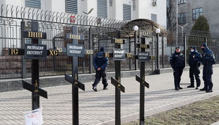 Crosses installed during a protest against Russias actions in Donbas are seen in front of the Russian embassy Kyiv, Ukraine February 23, 2022. Signs read: Russian occupier. — Reuters