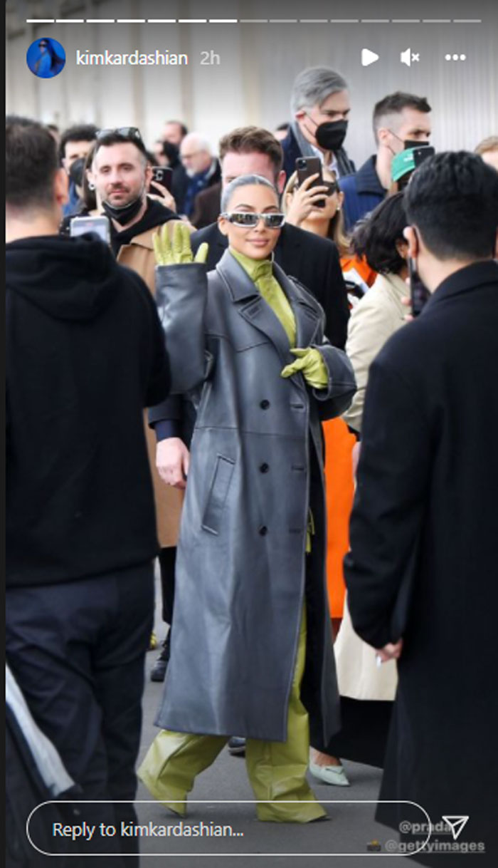 Kim Kardashian watches her sister Kendall Jenner on the catwalk at Milan Fashion Week