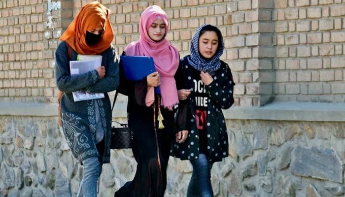 Students walk towards Kabul University after it was reopened in Kabul in Kabul six months after the Talibans return to power. — AFP