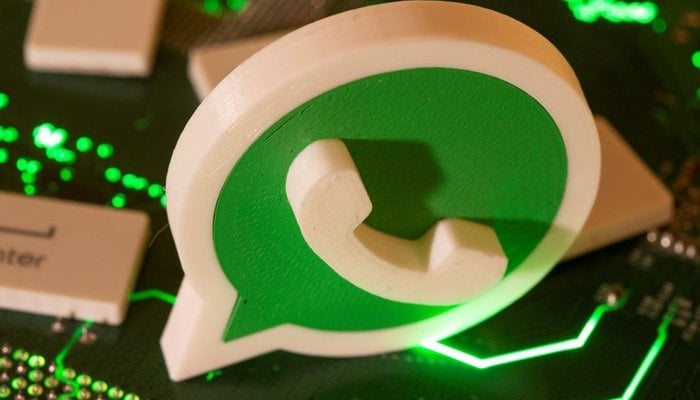 A 3D printed Whatsapp logo and keyboard buttons are placed on a computer motherboard in this illustration taken January 21, 2021. — Reuters