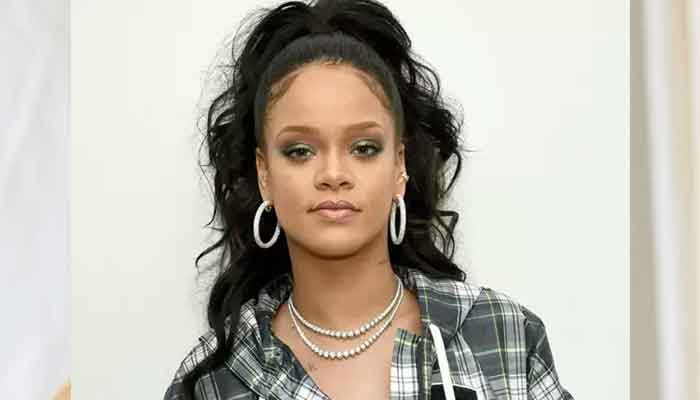 Rihanna turns heads in revealing outfit as she graces a fashion show in Paris