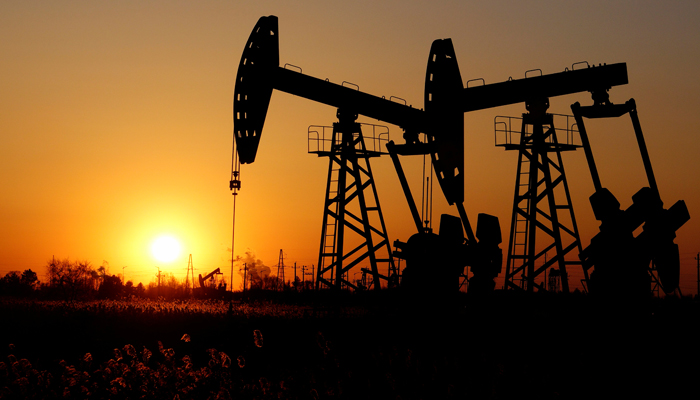 Pumpjacks are seen against the setting sun at the Daqing oil field in Heilongjiang province, China December 7, 2018. — Reuters/File