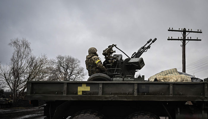An Ukrainian soldier keeps position sitting on a ZU-23-2 anti-aircraft gun at a frontline, northeast. Photo —AFP