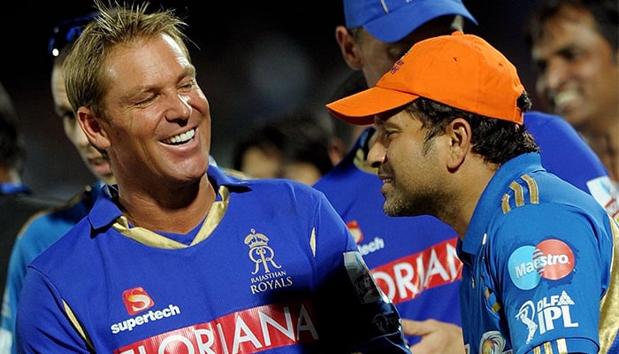 In this file photo taken on April 29, 2011, Rajasthan Royals captain Shane Warne (L) shares a slight moment with Mumbai Indians captain Sachin Tendulkar after Rajasthans victory during the IPL Twenty20 cricket match between Mumbai Indians and Rajasthan Royals at the Swai Man Singh Stadium in Jaipur. — AFP/File