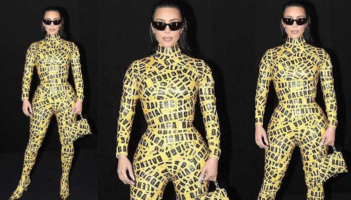 Kim Kardashian wraps herself in shipping tape catsuit at fashion show in Paris
