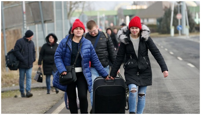 People flee from Ukraine at the Hungarian-Ukrainian border after Russian President Vladimir Putin authorized a military operation, in Beregsurany, Hungary, February 24, 2022. Photo: Reuters