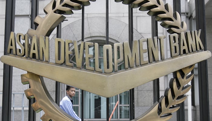 A worker walks past inside the Asian Development Bank (ADB) headquarters in Manila June 17, 2009. — Reuters/File