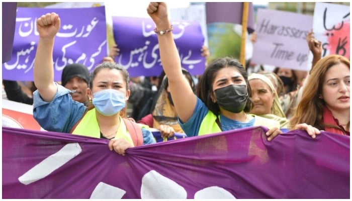 Aurat March protesters hold placards and shout slogans as they gather to mark International Womens Day in Islamabad — Farooq Naeem/ AFP