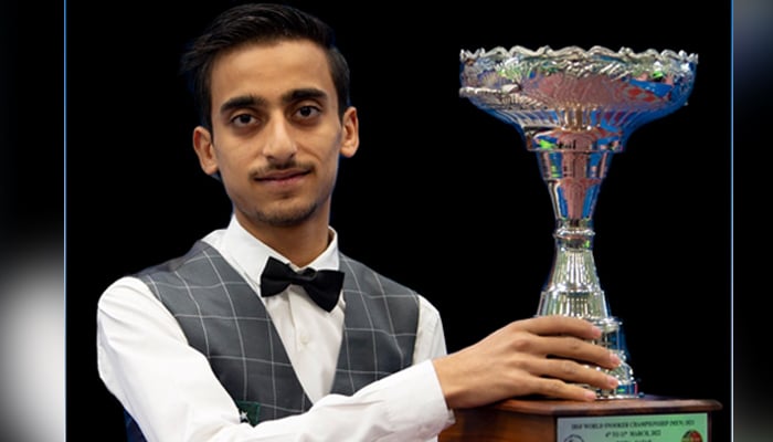 Pakistans Ahsan Ramzan lifts the IBSF World Snooker Championship title. — IBSF