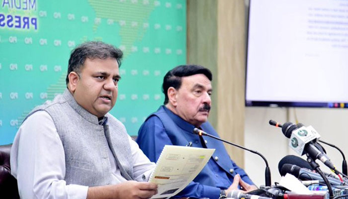 Federal Minister for Information and Broadcasting Fawad Chaudhry (L) and Interior Minister Sheikh Rasheed. — PID/File