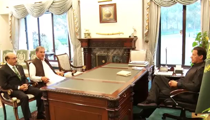 Prime Minister Imran Khan (right) meets Pakistan’s Ambassador-designate to the United States Sardar Masood Ahmed Khan (left) at PM Office in Islamabad, on March 14, 2022. — Twitter/@PakPMO