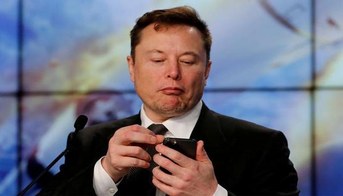 SpaceX founder and chief engineer Elon Musk look at his mobile phone during a post-launch news conference to discuss the SpaceX Crew Dragon astronaut capsule in-flight abort test at the Kennedy Space Center in Cape Canaveral, Florida, U.S. January 19, 2020. — Reuters/File