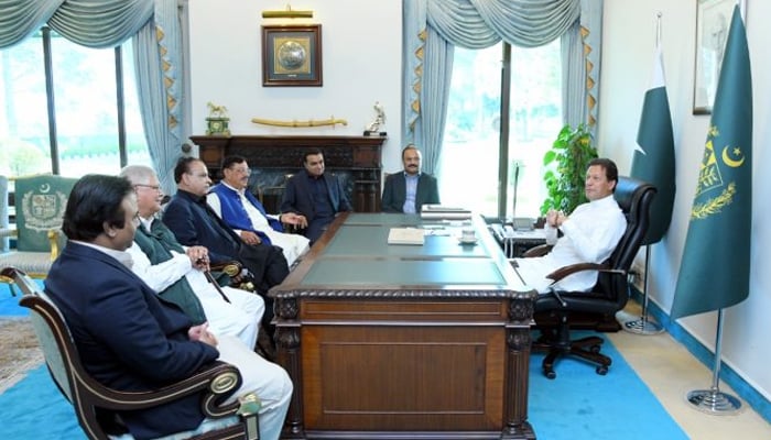 PM Imran Khan meets MNAs at PM Office. — APP