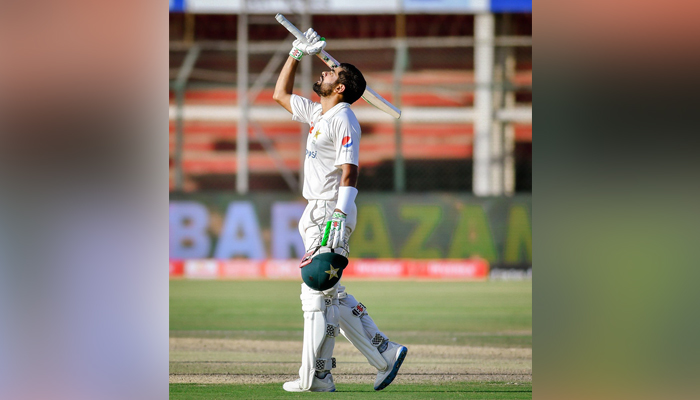 Pakistan captain Babar Azam raises the bat after completing his century against Australia at the National Stadium Karachi. — Twitter/PCB