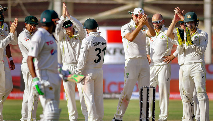 Babar Azam sees the Australian team appreciating him after he was dismissed for 196 by Nathan Lyon during the second Test at Karachi, on March 16, 2022. — Twitter/@andymcg_cricket via PCB