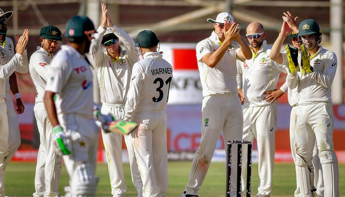 Babar Azam sees the Australian team appreciating him after he was dismissed for 196 by Nathan Lyon during the second Test at Karachi, on March 16, 2022. — Twitter/andymcg_cricket via PCB