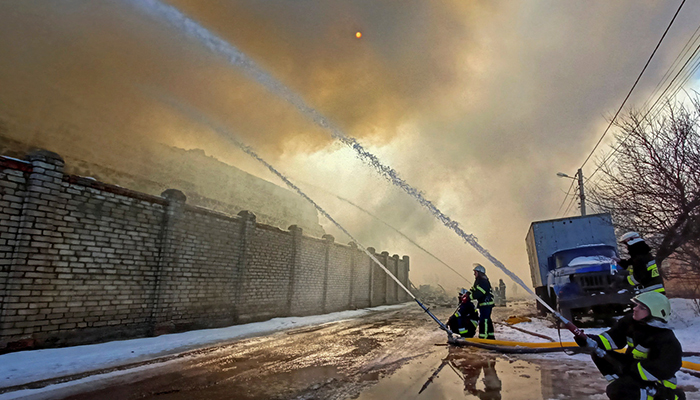 Rescuers work at a site of a warehouse storing products burned after shelling, as Russias attack on Ukraine continues, in Kharkiv, International news