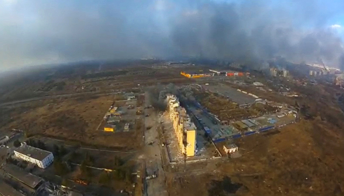 An aerial view shows smoke rising from damaged residential buildings following an explosion, amid Russias invasion of Ukraine, in Mariupol, Ukraine March 14, 2022 in this still image taken from a drone footage obtained from social media. — Reuters