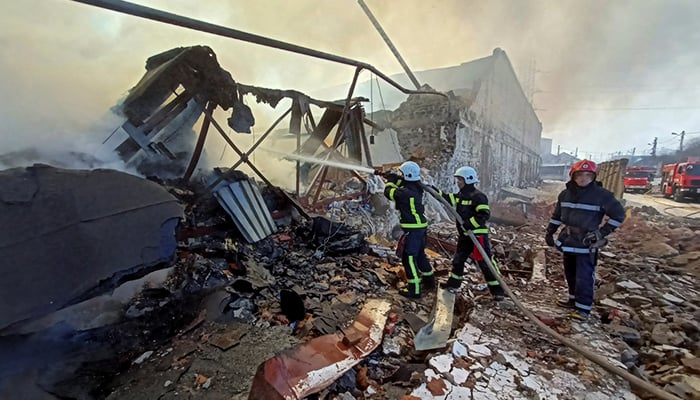 Rescuers work at a site of a warehouse storing products burned after shelling, as Russias attack on Ukraine continues, in Kharkiv, Ukraine March 16, 2022. — Reuters
