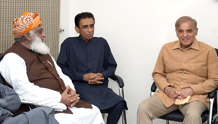 Pakistan Democratic Movement (PDM) chief Fazalur Rehman (left), MQM-P Convener Khalid Maqbool Siddiqui (centre), and Leader of the Opposition in National Assembly Shahbaz Sharif speak during a meeting in Islamabad, on March 16, 2022. — Online